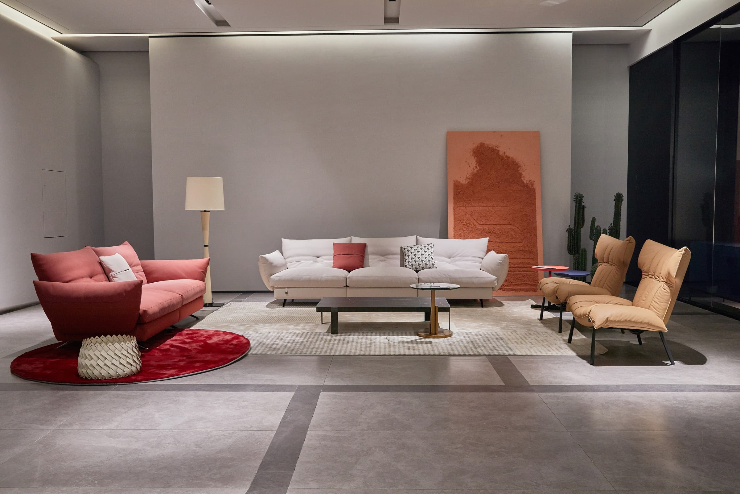 F9686 living room set with a white sofa, red lounge chair and tan armchair