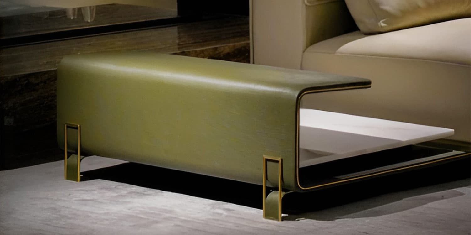 GC-018 olive leather table module with waterfall edge, stone inset shelf and brass leg brackets beside the sofa seat