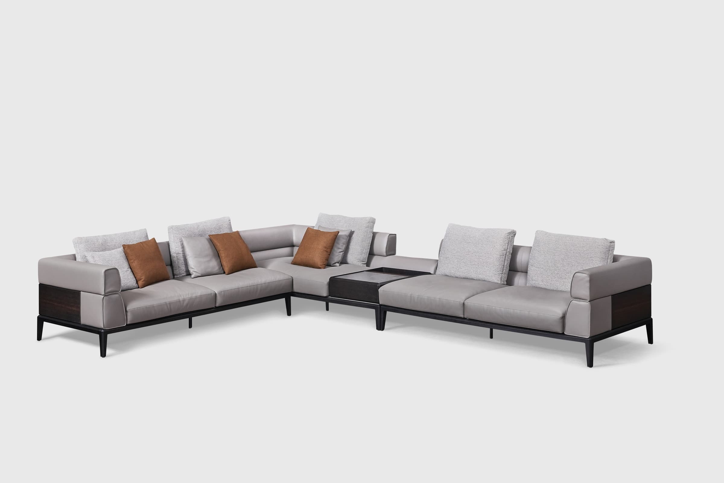 Katrine two-tone corner sectional on black legs showing timber side panels and recessed corner console surface